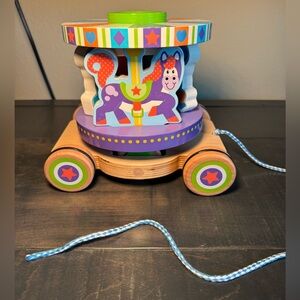 Melissa & Doug wooden spinning carousel pull toy with removable play pieces